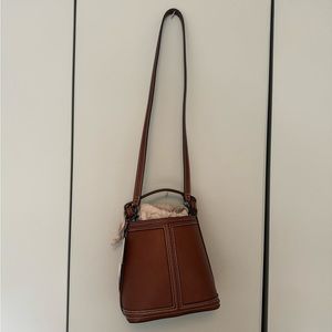 Zara leather bucket bag with contrast stitching.